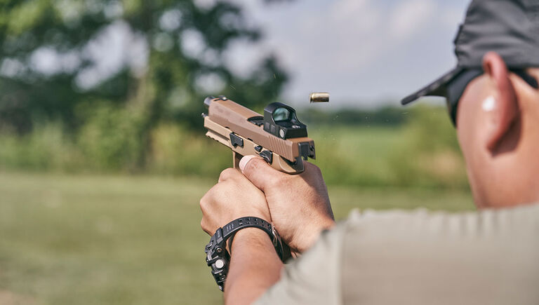 Bushnell RXS-100 Reflex Sight mounted on a pistol being fired